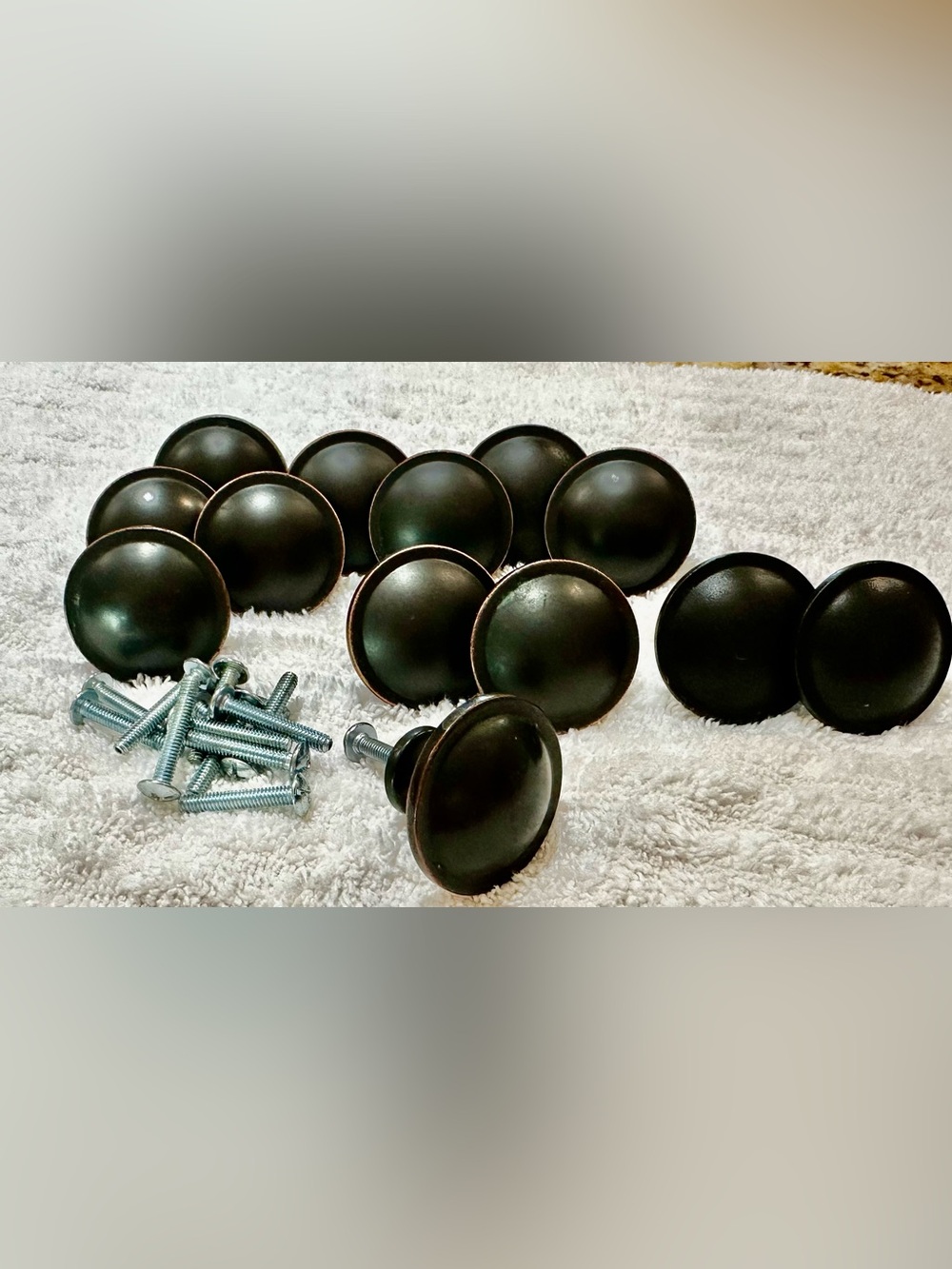 Lot of 13 Drawer knobs/pulls. 11 Dark Bronze tone, 2 black. Includes screws.